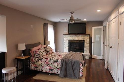 625 Dog Lake Road, Thunder Bay, ON - Indoor Photo Showing Bedroom With Fireplace