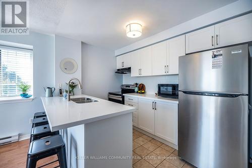 301 - 91 Aspen Springs Drive, Clarington (Bowmanville), ON - Indoor Photo Showing Kitchen With Double Sink