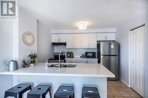 301 - 91 Aspen Springs Drive, Clarington (Bowmanville), ON - Indoor Photo Showing Kitchen With Double Sink