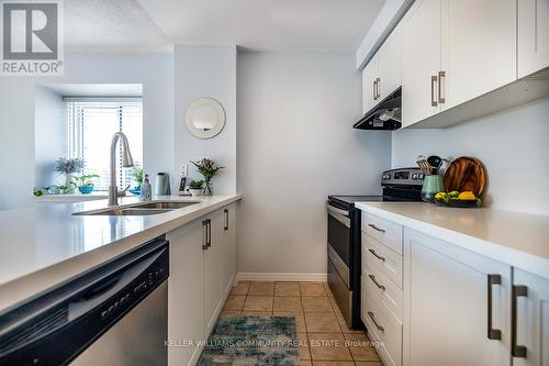 301 - 91 Aspen Springs Drive, Clarington (Bowmanville), ON - Indoor Photo Showing Kitchen With Double Sink