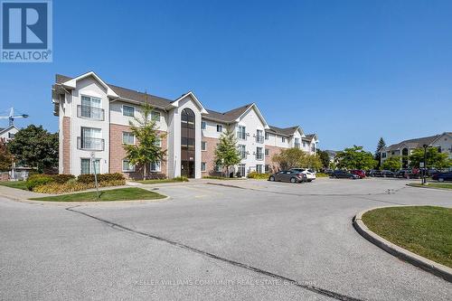 301 - 91 Aspen Springs Drive, Clarington (Bowmanville), ON - Outdoor With Facade