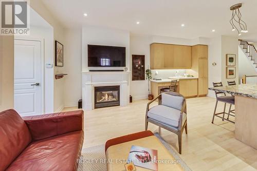 113 Winners Circle, Toronto, ON - Indoor Photo Showing Living Room With Fireplace