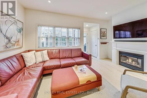 113 Winners Circle, Toronto, ON - Indoor Photo Showing Living Room With Fireplace