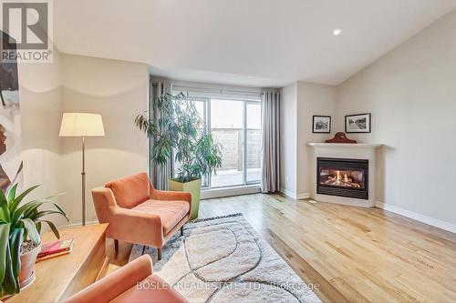 113 Winners Circle, Toronto, ON - Indoor Photo Showing Living Room With Fireplace