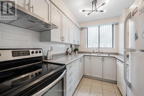 103 - 10 Tapscott Road, Toronto, ON - Indoor Photo Showing Kitchen With Double Sink