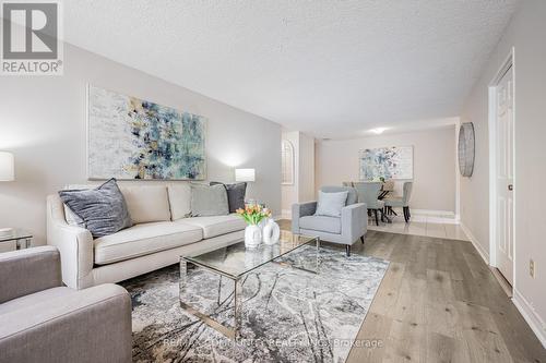 103 - 10 Tapscott Road, Toronto, ON - Indoor Photo Showing Living Room