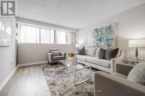 103 - 10 Tapscott Road, Toronto, ON - Indoor Photo Showing Living Room