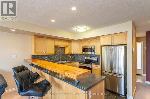 20 - 40 Ontario Street S, Lambton Shores (Grand Bend), ON - Indoor Photo Showing Kitchen With Stainless Steel Kitchen