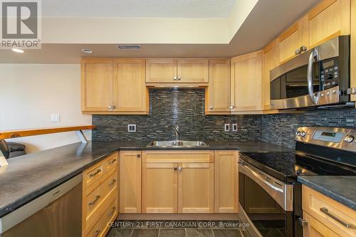 20 - 40 Ontario Street S, Lambton Shores (Grand Bend), ON - Indoor Photo Showing Kitchen With Double Sink