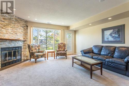 20 - 40 Ontario Street S, Lambton Shores (Grand Bend), ON - Indoor Photo Showing Living Room With Fireplace