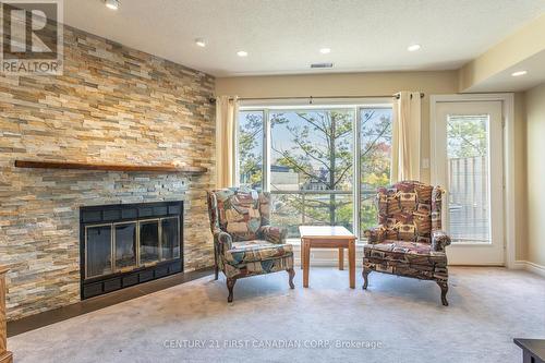 20 - 40 Ontario Street S, Lambton Shores (Grand Bend), ON - Indoor Photo Showing Living Room With Fireplace