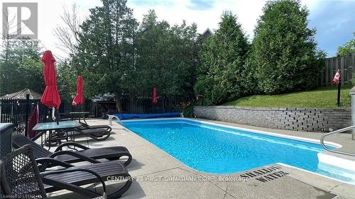 In-Ground Saltwater Pool, Firepit Area & Gazebo - 20 - 40 Ontario Street S, Lambton Shores (Grand Bend), ON - Outdoor With In Ground Pool With Backyard