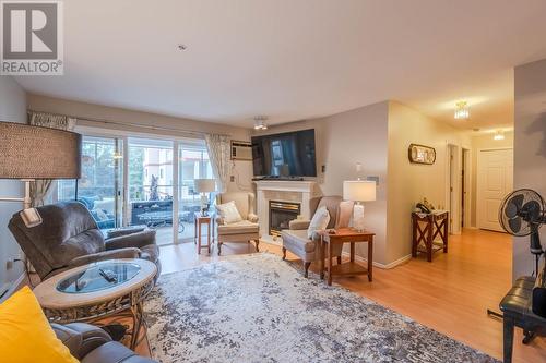 130 Abbott Street Unit# 309, Penticton, BC - Indoor Photo Showing Living Room With Fireplace