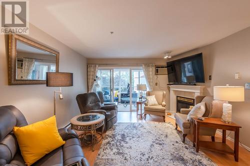 130 Abbott Street Unit# 309, Penticton, BC - Indoor Photo Showing Living Room With Fireplace