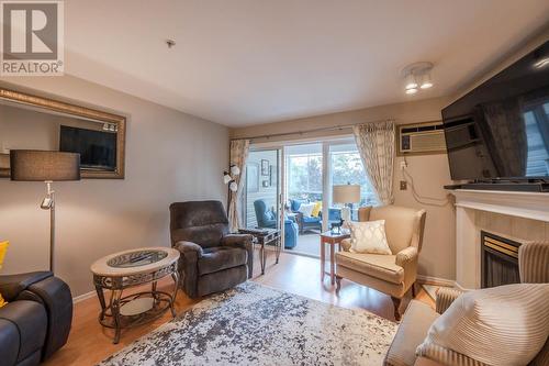 130 Abbott Street Unit# 309, Penticton, BC - Indoor Photo Showing Living Room With Fireplace