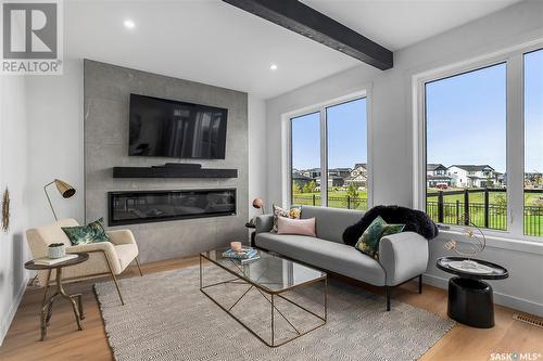 127 Asokan Street, Saskatoon, SK - Indoor Photo Showing Living Room With Fireplace