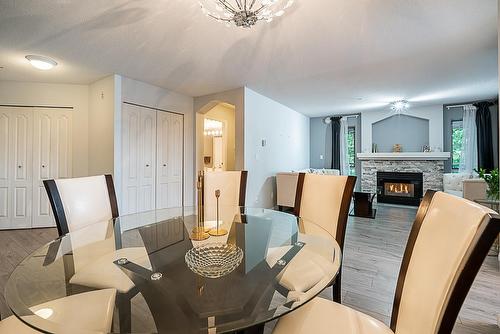 234 19528 Fraser Highway, Surrey, BC - Indoor Photo Showing Dining Room With Fireplace