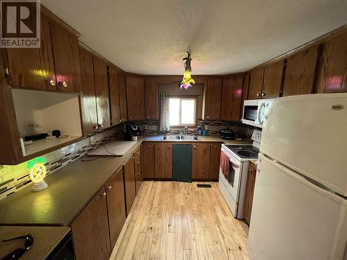 5251 42 Street, Fort Nelson, BC - Indoor Photo Showing Kitchen With Double Sink