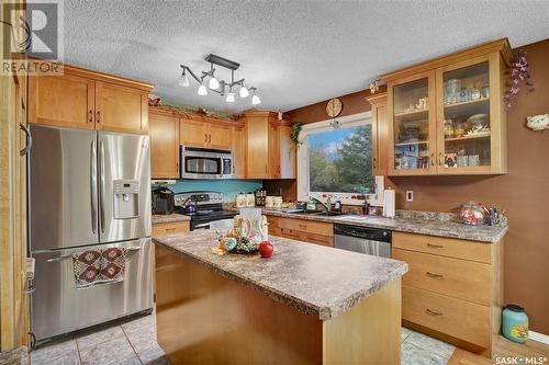 702 4Th Street S, Martensville, SK - Indoor Photo Showing Kitchen With Double Sink