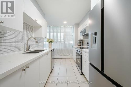 305 - 5580 Sheppard Avenue E, Toronto, ON - Indoor Photo Showing Kitchen With Double Sink With Upgraded Kitchen