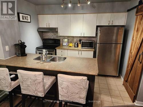 207 - 90 Aspen Springs Drive, Clarington, ON - Indoor Photo Showing Kitchen With Double Sink