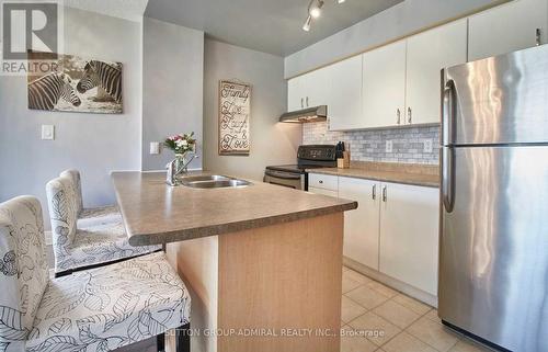 207 - 90 Aspen Springs Drive, Clarington, ON - Indoor Photo Showing Kitchen With Double Sink