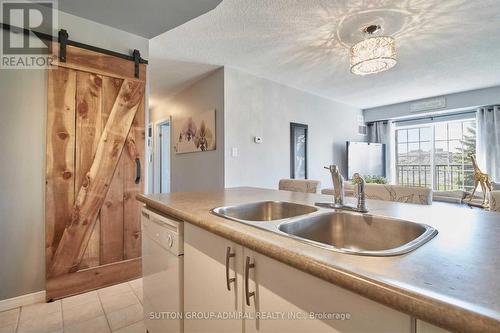 207 - 90 Aspen Springs Drive, Clarington, ON - Indoor Photo Showing Kitchen With Double Sink