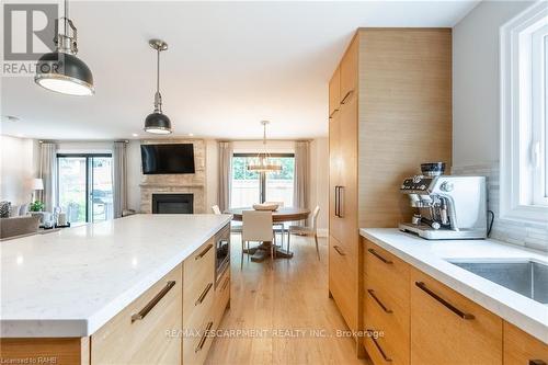 3410 Spruce Avenue, Burlington, ON - Indoor Photo Showing Kitchen With Fireplace