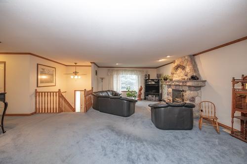 7706 Giles Drive, Coldstream, BC - Indoor With Fireplace