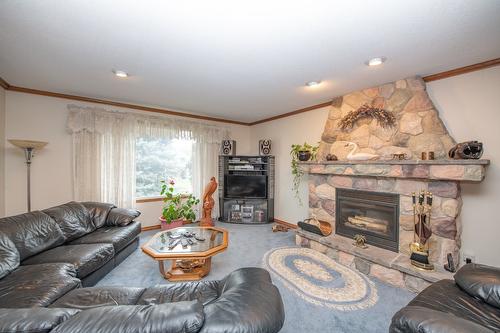 7706 Giles Drive, Coldstream, BC - Indoor Photo Showing Living Room With Fireplace