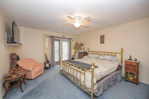 7706 Giles Drive, Coldstream, BC - Indoor Photo Showing Bedroom