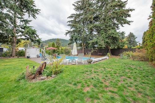 7706 Giles Drive, Coldstream, BC - Outdoor With In Ground Pool With Backyard