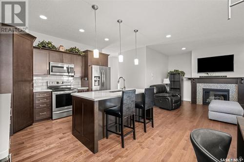 24 2805 Lakeview Drive, Prince Albert, SK - Indoor Photo Showing Kitchen With Fireplace With Stainless Steel Kitchen With Upgraded Kitchen