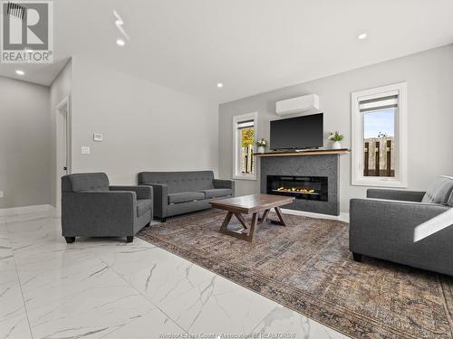 1320 Grand Marais Road East, Windsor, ON - Indoor Photo Showing Living Room With Fireplace