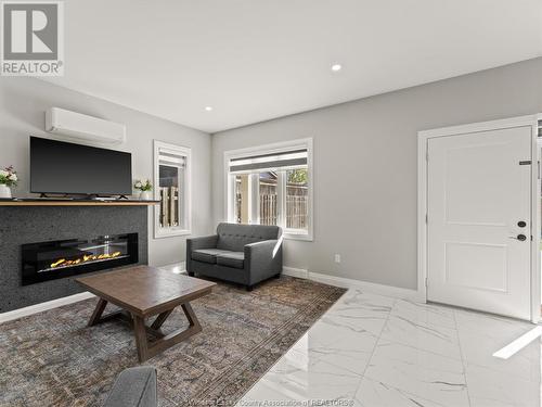 1320 Grand Marais Road East, Windsor, ON - Indoor Photo Showing Living Room With Fireplace