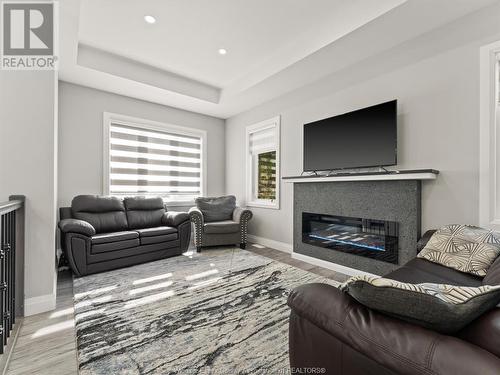 1320 Grand Marais Road East, Windsor, ON - Indoor Photo Showing Living Room With Fireplace