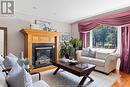 13902 Riverside Drive East, Tecumseh, ON  - Indoor Photo Showing Living Room With Fireplace 