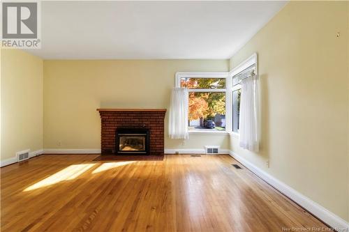 28 Kensington, Moncton, NB - Indoor Photo Showing Living Room With Fireplace