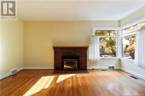 28 Kensington, Moncton, NB - Indoor Photo Showing Living Room With Fireplace