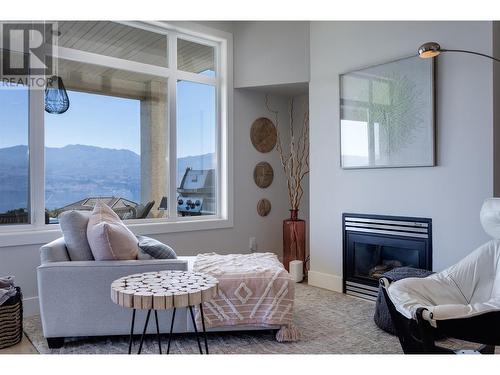 1608 Braeburn Court, West Kelowna, BC - Indoor Photo Showing Bedroom With Fireplace