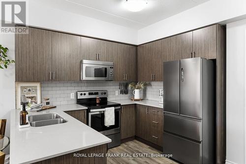 218 - 290 Liberty Street N, Clarington (Bowmanville), ON - Indoor Photo Showing Kitchen With Stainless Steel Kitchen With Double Sink With Upgraded Kitchen