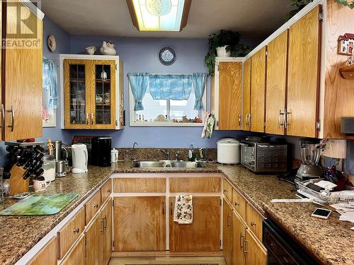 108 3Rd Avenue Nw, Nakusp, BC - Indoor Photo Showing Kitchen With Double Sink