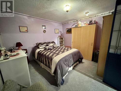 108 3Rd Avenue Nw, Nakusp, BC - Indoor Photo Showing Bedroom