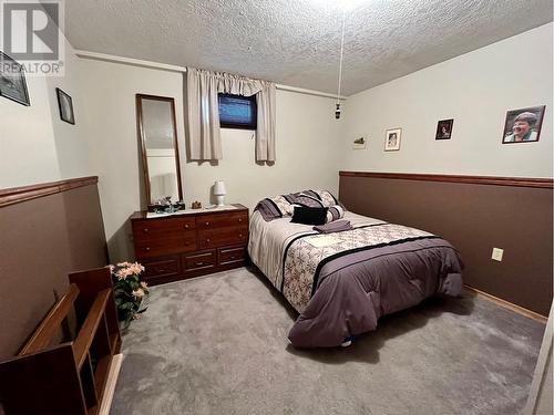 108 3Rd Avenue Nw, Nakusp, BC - Indoor Photo Showing Bedroom