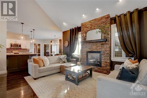 6646 Stillwood Drive, Ottawa, ON - Indoor Photo Showing Living Room With Fireplace