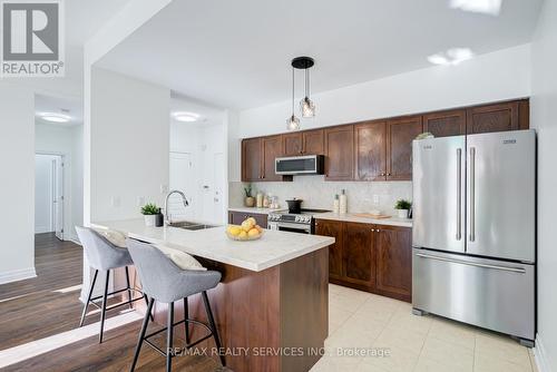 105 - 5070 Fairview Street, Burlington, ON - Indoor Photo Showing Kitchen With Stainless Steel Kitchen