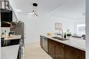 105 - 5070 Fairview Street, Burlington, ON  - Indoor Photo Showing Kitchen With Double Sink 