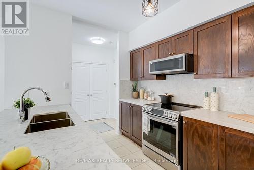 105 - 5070 Fairview Street, Burlington, ON - Indoor Photo Showing Kitchen With Double Sink