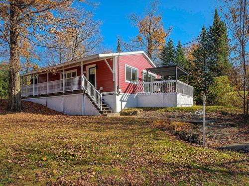 Back facade - 1626 Ch. De La Baie-Du-Lac, Saint-Sauveur, QC - Outdoor With Deck Patio Veranda