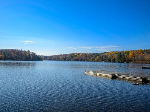 1626 Ch. De La Baie-Du-Lac, Saint-Sauveur, QC - Outdoor With Body Of Water With View